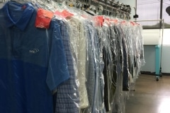 Rack of clean clothes at Tailor Fit Cleaners.